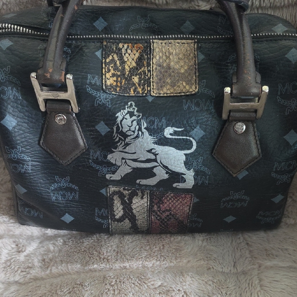 MCM Black and Gold Duffel Bag with Monogram Design